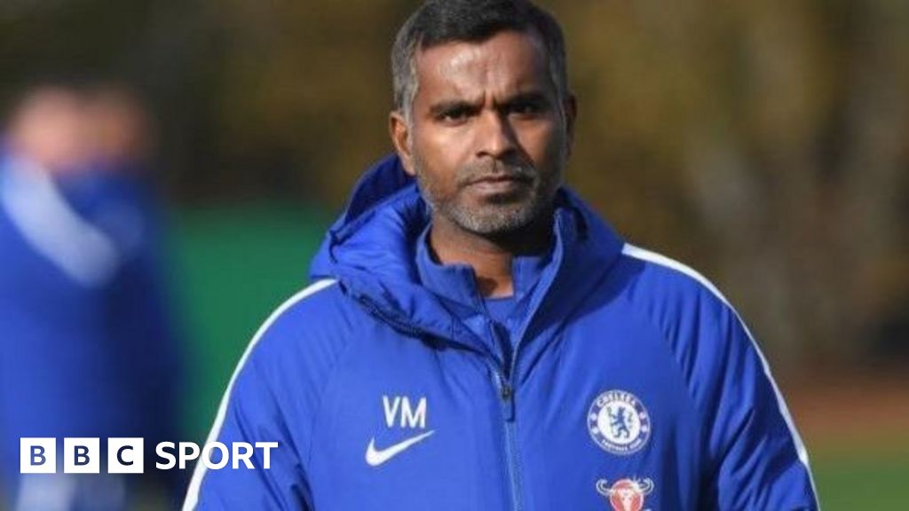 Vinay Menon at Chelsea training wearing a Chelsea jacket