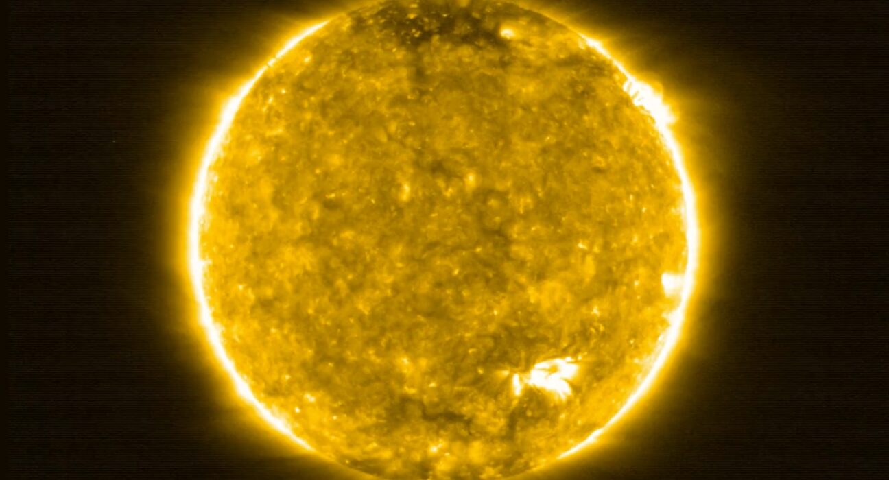 A false-color image of the sun in ultraviolet light showing flares and eruptions breaking from its surface