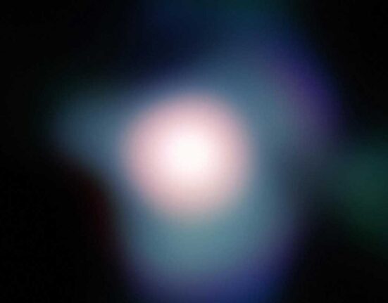 Blurry light from the red giant star Betelgeuse in the constellation Orion.